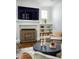 Bright living room features a fireplace, built-in shelving and modern furnishings at 331 Gordon Ne Ave, Atlanta, GA 30307