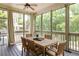 A comfortable screened patio with an outdoor table and green views at 331 Gordon Ne Ave, Atlanta, GA 30307