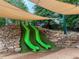 Dual green slides built into a rock and turf hill covered by large shade canopies at 331 Gordon Ne Ave, Atlanta, GA 30307