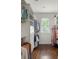 Well-organized walk-in closet with custom shelving, drawers, and hanging rods, complemented by dark wood flooring at 331 Gordon Ne Ave, Atlanta, GA 30307