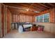 Unfinished basement ready to be customized, featuring a window and exposed framework at 332 Red Fox Dr, Canton, GA 30114