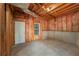 Unfinished basement space with concrete floor, ready for customization, includes window and door at 332 Red Fox Dr, Canton, GA 30114