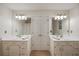 Bright bathroom features dual vanity sinks, updated fixtures, and modern lighting at 332 Red Fox Dr, Canton, GA 30114