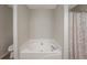 Relaxing bathroom corner showcases a corner soaking tub and a separate shower area at 332 Red Fox Dr, Canton, GA 30114