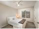 Cozy bedroom with carpet, a ceiling fan, and a window offering natural light at 332 Red Fox Dr, Canton, GA 30114