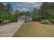 Charming two-story home features a well-manicured lawn and a two-car garage at 332 Red Fox Dr, Canton, GA 30114