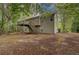 Two-story home with rear deck and stairs provides a spacious outdoor area and easy access to the backyard at 332 Red Fox Dr, Canton, GA 30114