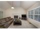 Spacious living room with a fireplace, high ceilings, and comfortable seating arrangement at 332 Red Fox Dr, Canton, GA 30114