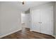 Bedroom with hardwood floors, closet, and hallway entrance at 2035 Mountain Rd, Cumming, GA 30040
