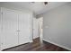 Bedroom featuring hardwood floors, closet, and hallway entrance at 2035 Mountain Rd, Cumming, GA 30040