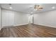 Large bedroom featuring hardwood floors, closet, and ceiling fan at 2035 Mountain Rd, Cumming, GA 30040
