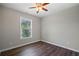 Bright bedroom featuring hardwood floors and a window view at 2035 Mountain Rd, Cumming, GA 30040