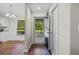 Bright foyer with hardwood floors, coat closet, and view of the front yard at 2035 Mountain Rd, Cumming, GA 30040