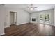 Inviting living room with vaulted ceilings, fireplace, and access to outdoor patio at 2035 Mountain Rd, Cumming, GA 30040