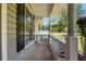 Covered porch featuring white railings, columns, and nice outdoor view at 2035 Mountain Rd, Cumming, GA 30040