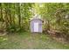 Outdoor storage shed is secluded by woods at 2035 Mountain Rd, Cumming, GA 30040