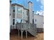 Exterior view of the deck with an umbrella, and the tan siding of the home at 376 Eagle Tiff Dr, Sugar Hill, GA 30518