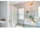 Bright bathroom includes a double vanity, framed mirror, shower, and decor at 376 Eagle Tiff Dr, Sugar Hill, GA 30518