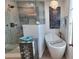 Stylish bathroom featuring a glass enclosed shower, modern bathtub, and decor accents at 376 Eagle Tiff Dr, Sugar Hill, GA 30518
