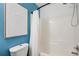 Updated bathroom with a white shower-tub combination and a white-bowl toilet at 376 Eagle Tiff Dr, Sugar Hill, GA 30518