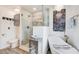 Modern bathroom featuring a separate shower and soaking tub, as well as neutral tiling at 376 Eagle Tiff Dr, Sugar Hill, GA 30518
