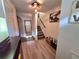 Inviting entryway with wood floors, staircase, and decorative accents at 376 Eagle Tiff Dr, Sugar Hill, GA 30518