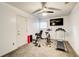 Home gym features a treadmill, exercise bike, weight bench, and a wall-mounted TV at 376 Eagle Tiff Dr, Sugar Hill, GA 30518