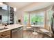 Cozy breakfast nook off the kitchen with bright lighting and a view of the outdoors at 376 Eagle Tiff Dr, Sugar Hill, GA 30518