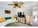 Comfortable living room featuring decorative lamps, mounted TV, and stylish decor at 376 Eagle Tiff Dr, Sugar Hill, GA 30518