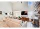 Spacious living room showcasing a wood accent wall, lots of natural light, and high ceilings at 376 Eagle Tiff Dr, Sugar Hill, GA 30518