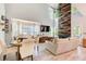 Open-concept living and dining area with lots of natural light and stylish furnishings at 376 Eagle Tiff Dr, Sugar Hill, GA 30518