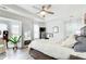 Spacious main bedroom with tray ceilings, neutral tones, and lots of natural light at 376 Eagle Tiff Dr, Sugar Hill, GA 30518