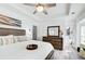 Cozy main bedroom featuring neutral tones, modern furniture, and bathroom access at 376 Eagle Tiff Dr, Sugar Hill, GA 30518