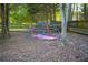 Backyard dome climber under mature trees, with a fenced perimeter for privacy at 4015 Dodds Grove Ln, Alpharetta, GA 30009