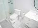 Contemporary bathroom with glass-enclosed shower, toilet with footstool, and vanity, all in a modern design at 4015 Dodds Grove Ln, Alpharetta, GA 30009