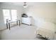 Well-lit bedroom with desk, dresser, single bed, and wainscoting offering a comfortable and functional space at 4015 Dodds Grove Ln, Alpharetta, GA 30009