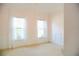 Light and airy bedroom with pink walls, white wainscoting, and two windows, creating a serene atmosphere at 4015 Dodds Grove Ln, Alpharetta, GA 30009