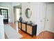 Welcoming foyer with stylish console table, decorative mirror, and natural light at 4015 Dodds Grove Ln, Alpharetta, GA 30009