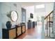 Inviting foyer with staircase, hardwood floors, and decorative accents at 4015 Dodds Grove Ln, Alpharetta, GA 30009