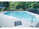 View of community pool, showing crystal-clear water and ample seating around the pool deck at 4015 Dodds Grove Ln, Alpharetta, GA 30009