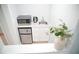 A basement wet bar that includes a mini fridge, sink, and microwave at 4015 Dodds Grove Ln, Alpharetta, GA 30009