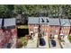 Aerial view of townhome community featuring mature trees and manicured lawns at 5589 Trace Views Dr, Norcross, GA 30071