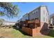Backyard view of townhome featuring private, fenced patio and green lawn at 5589 Trace Views Dr, Norcross, GA 30071