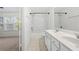 Bathroom featuring a double vanity and shower-tub combination at 5589 Trace Views Dr, Norcross, GA 30071