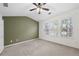 Spacious bedroom features a vaulted ceiling, neutral carpet, and ample natural light from the many large windows at 5589 Trace Views Dr, Norcross, GA 30071
