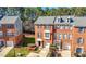Brick townhome with an attached garage and well-maintained landscaping at 5589 Trace Views Dr, Norcross, GA 30071