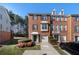 Brick townhome with an attached garage and well-maintained landscaping at 5589 Trace Views Dr, Norcross, GA 30071