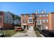 Charming brick townhome featuring an attached garage and well-maintained landscaping at 5589 Trace Views Dr, Norcross, GA 30071