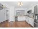 Bright kitchen with white cabinets and stainless steel appliances at 5589 Trace Views Dr, Norcross, GA 30071