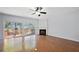 A spacious living room featuring hardwood floors, fireplace, and sliding doors to the deck at 5589 Trace Views Dr, Norcross, GA 30071